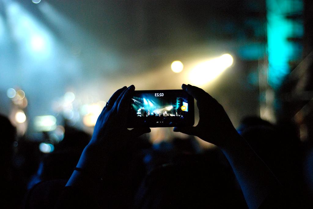 Professional event stage with dramatic lighting and sound equipment